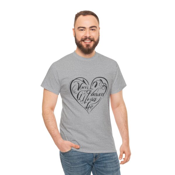 a man with a beard wearing a grey shirt with a heart on it