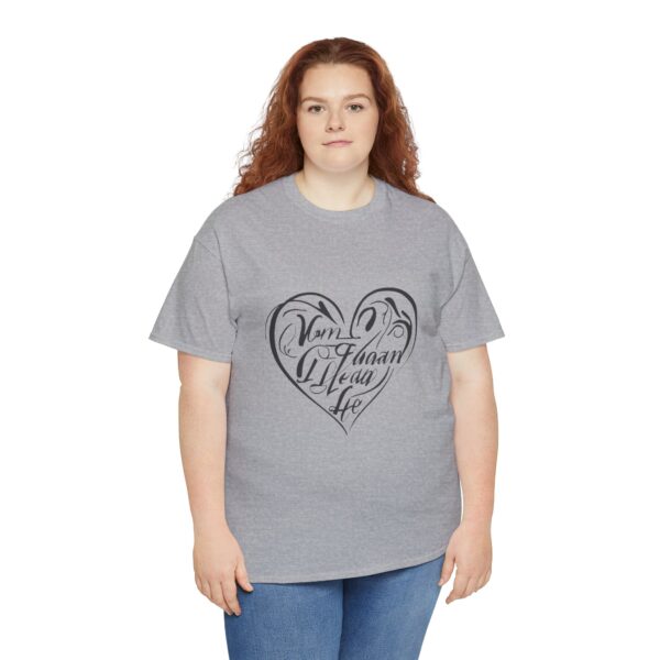 a woman wearing a grey shirt with a heart on it